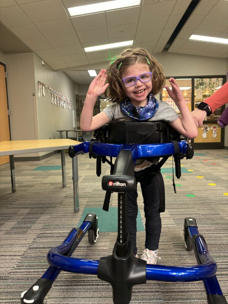 Student in a pacer, a device that assists with walking